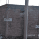 Walls of the construction site, with ministry labels now declaring the area secured.